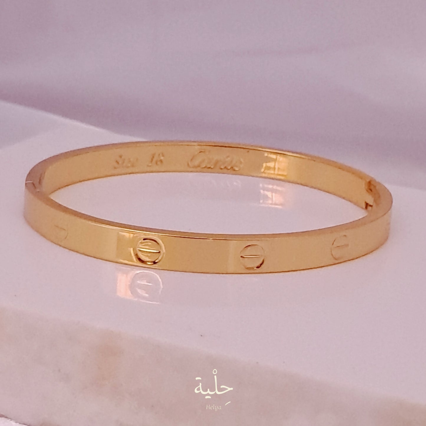 cartier stainless steel bracelet - gold