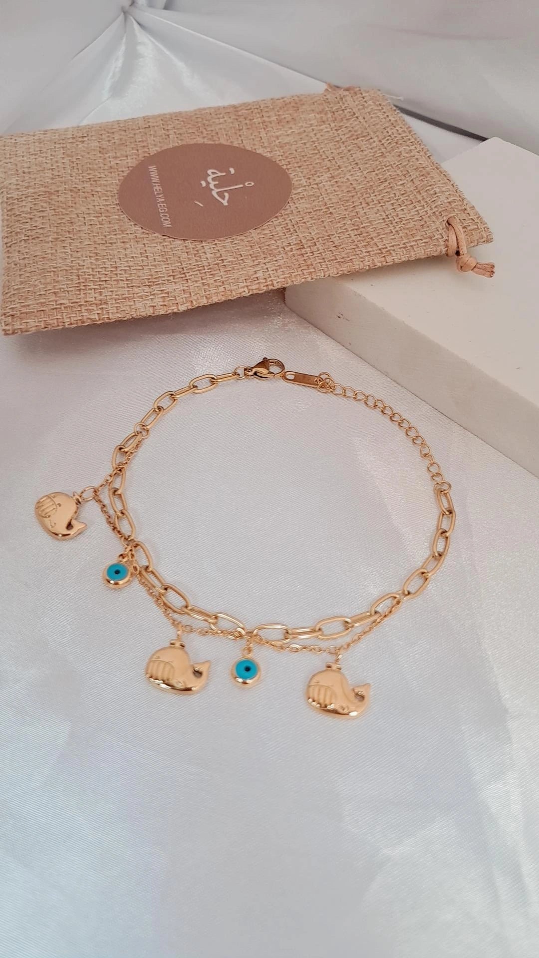 Stainless steel bracelet with five charm - gold