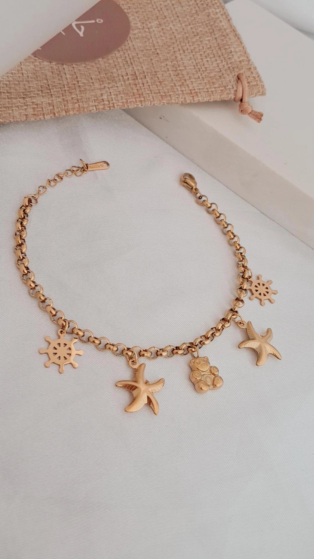 Stainless steel bracelet with five charm - gold
